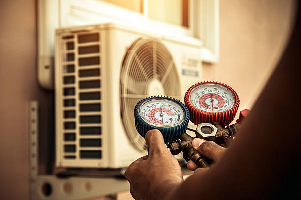 Professional Air Conditioning Service technician working in Rialto, CA